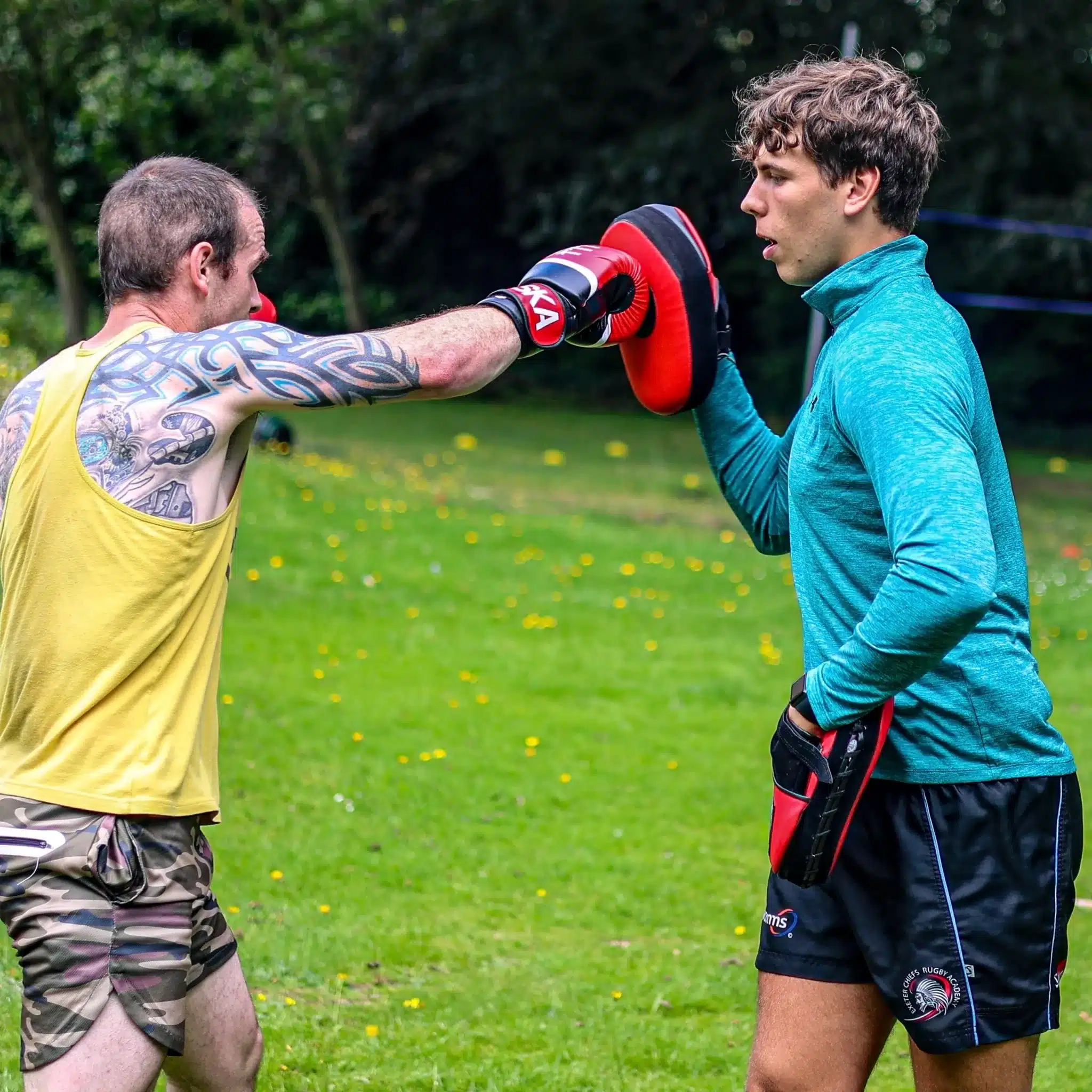 Mark boxing with instructor George in our fitness boot camp